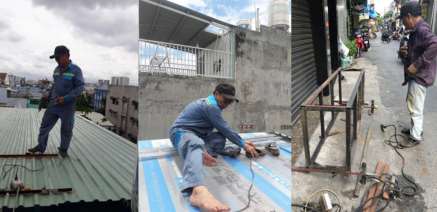 Thợ hàn đang sửa chữa cửa sắt tại nhà